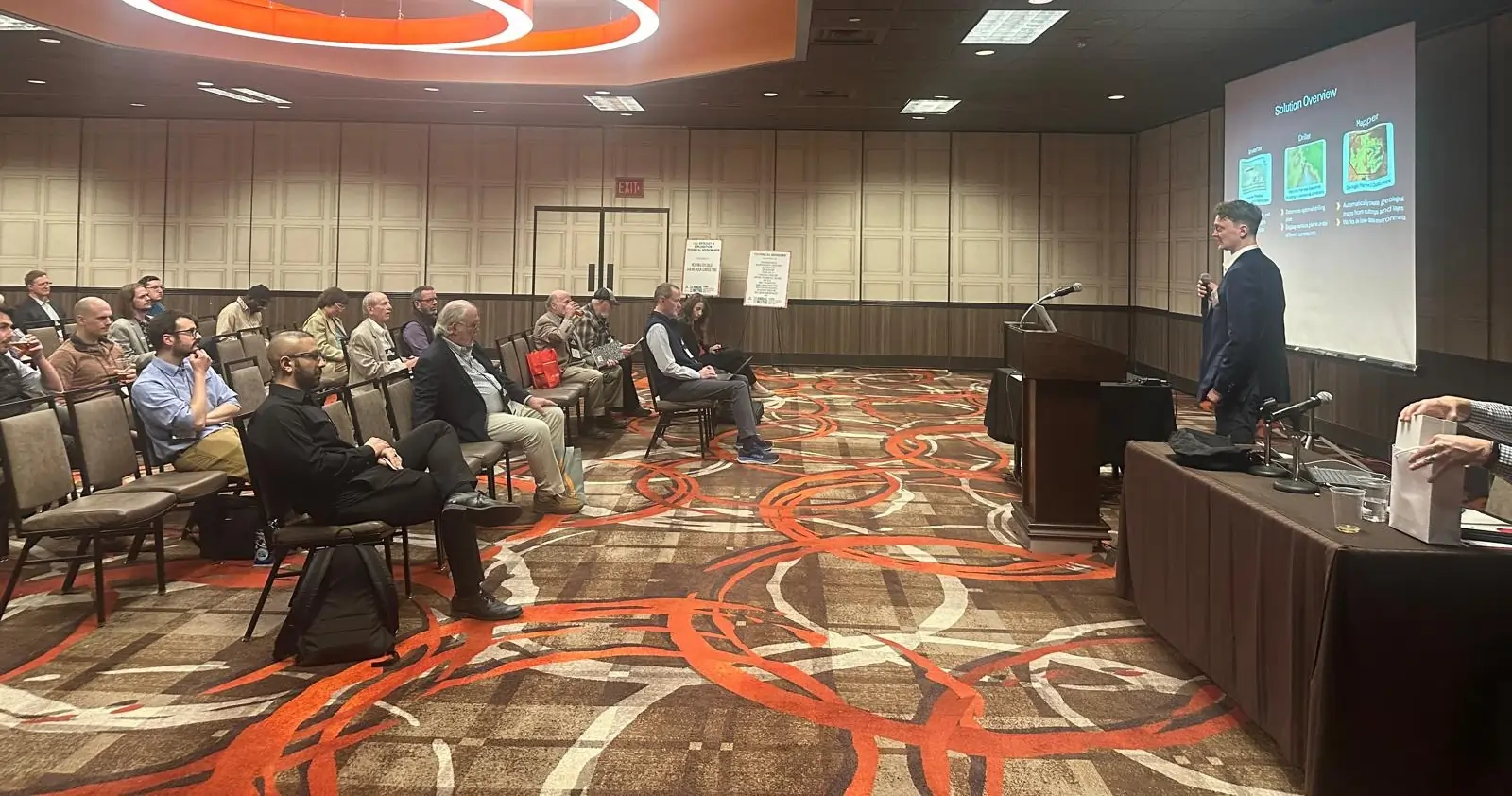 ExploreTech co-founders presenting exploration technology at AEMA mining conference in Reno, Nevada